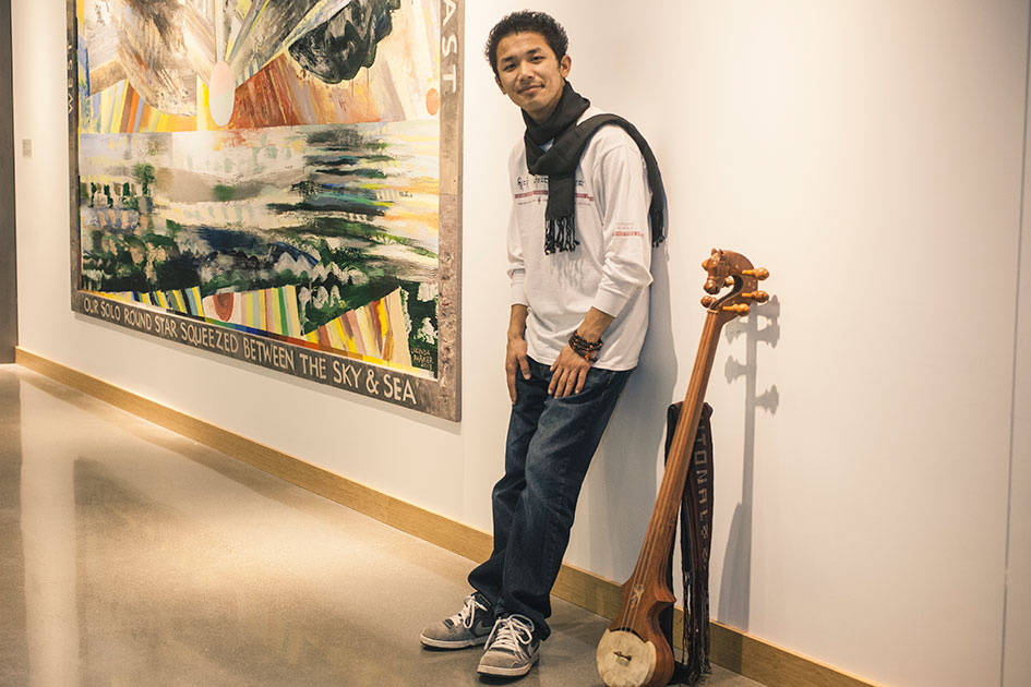 Tenzin Sangpo &amp;#8217;18 with a Tibetan lute he brought with him from India. The stringed instrument is known as a dramyin, which means &amp;#8220;pleasant sounding&amp;#8221; in Tibetan.
