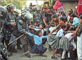 Mechi Mahakali School student (center) protests the destruction of her school and home.