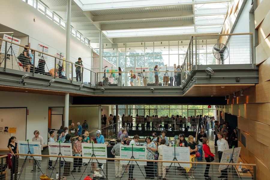 Three floors of PAB building with students presenting posters