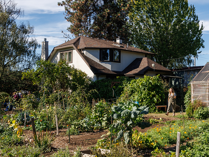 Exterior of Garden House, a small residence hall at Reed College, with the Reed garden in the foreground.