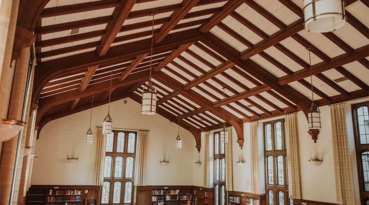 The intricate woodwork of the ceiling of the library