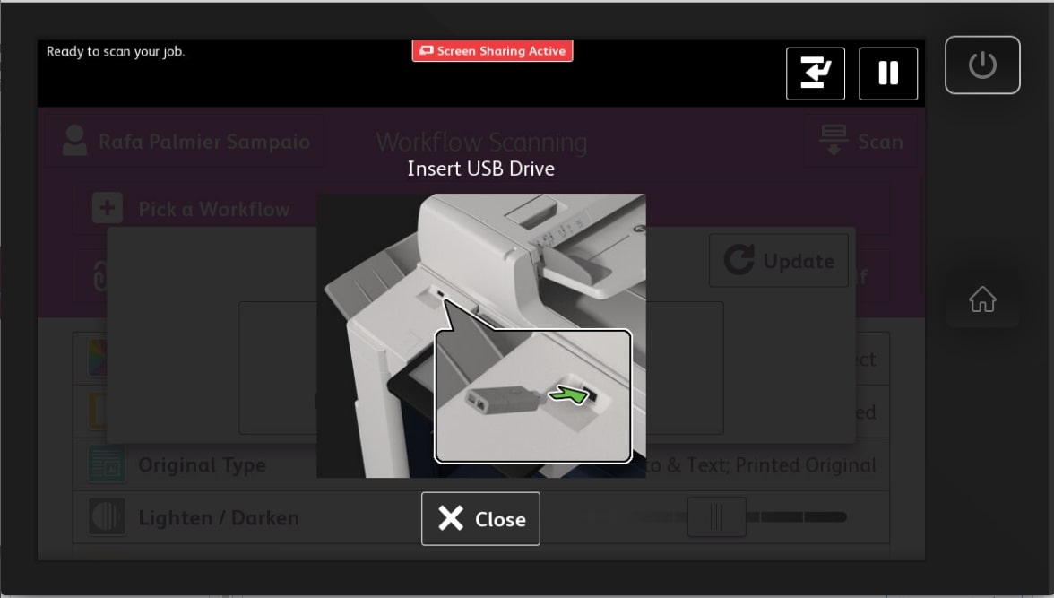 A screen illustrating how to insert a USB into the machine. 