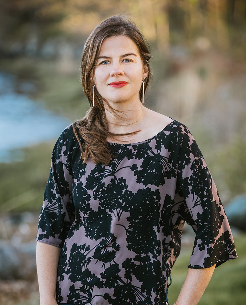 Commencement speaker Elizabeth Rush posing for a headshot outside.
