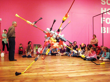 Gregory Macnaughton and Elizabeth Bidart '12, discuss the work of peter kreider with a group of young students, 2007.