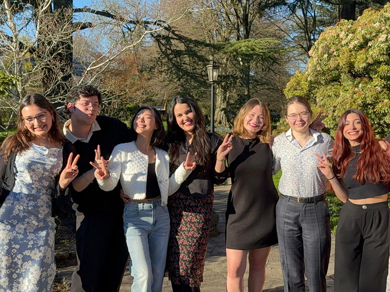 Seven Language Scholars pose for a photo outside.