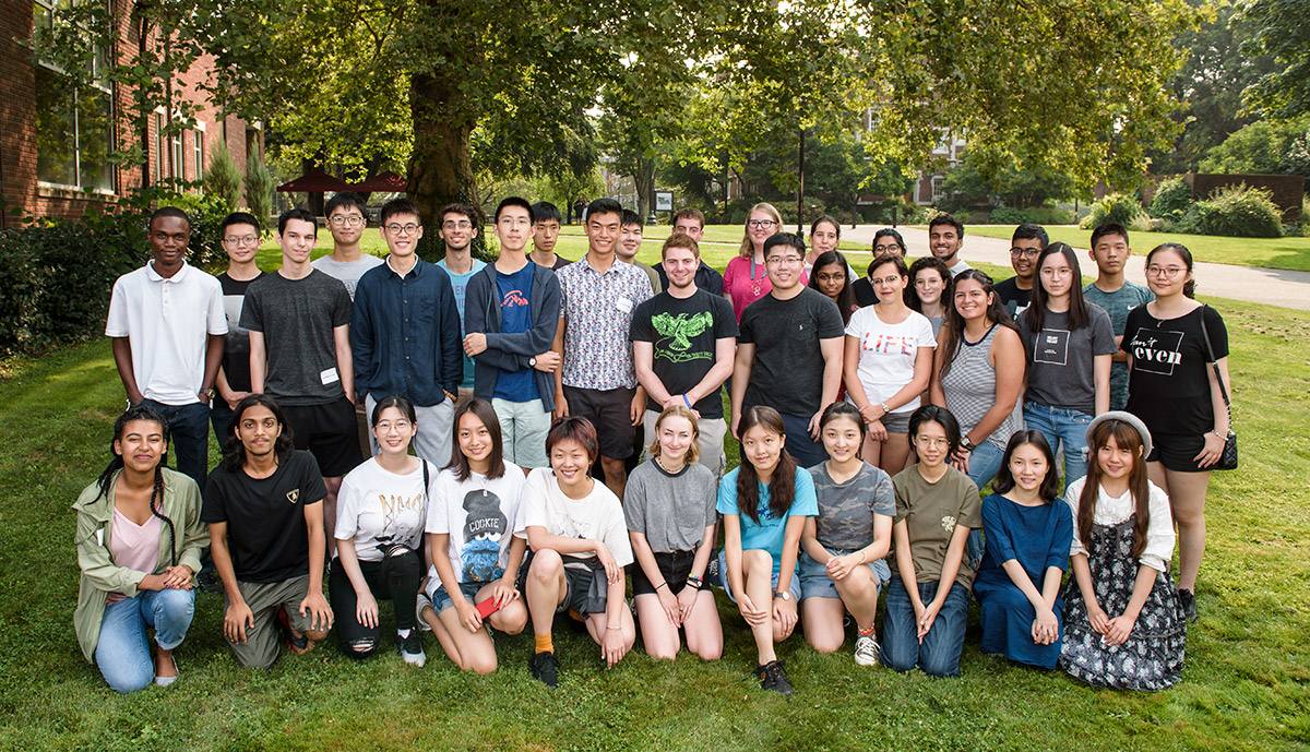 large group of international students assembled for a formal group photo