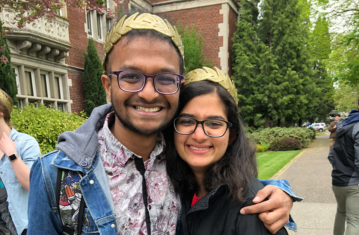 photo of two graduating international students smiling
