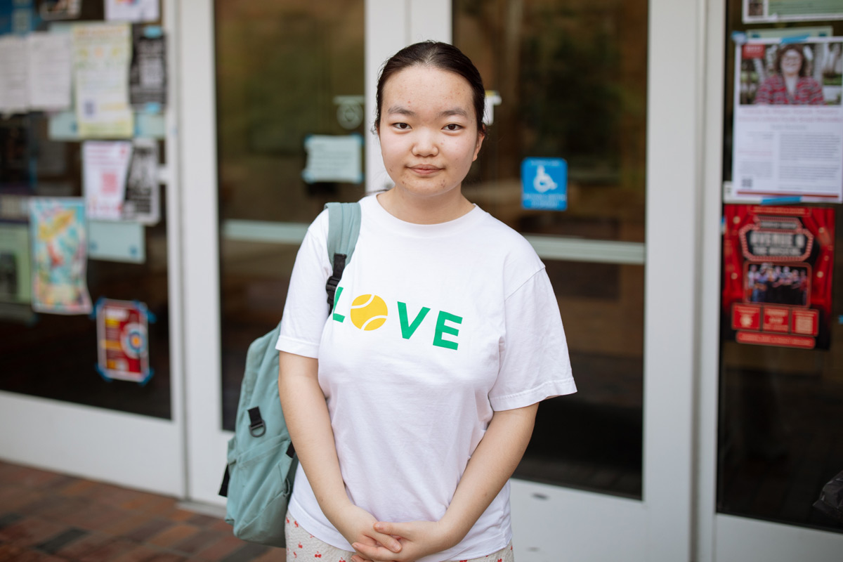 Headshot of Luna Lu standing outside the Gray Campus Center.