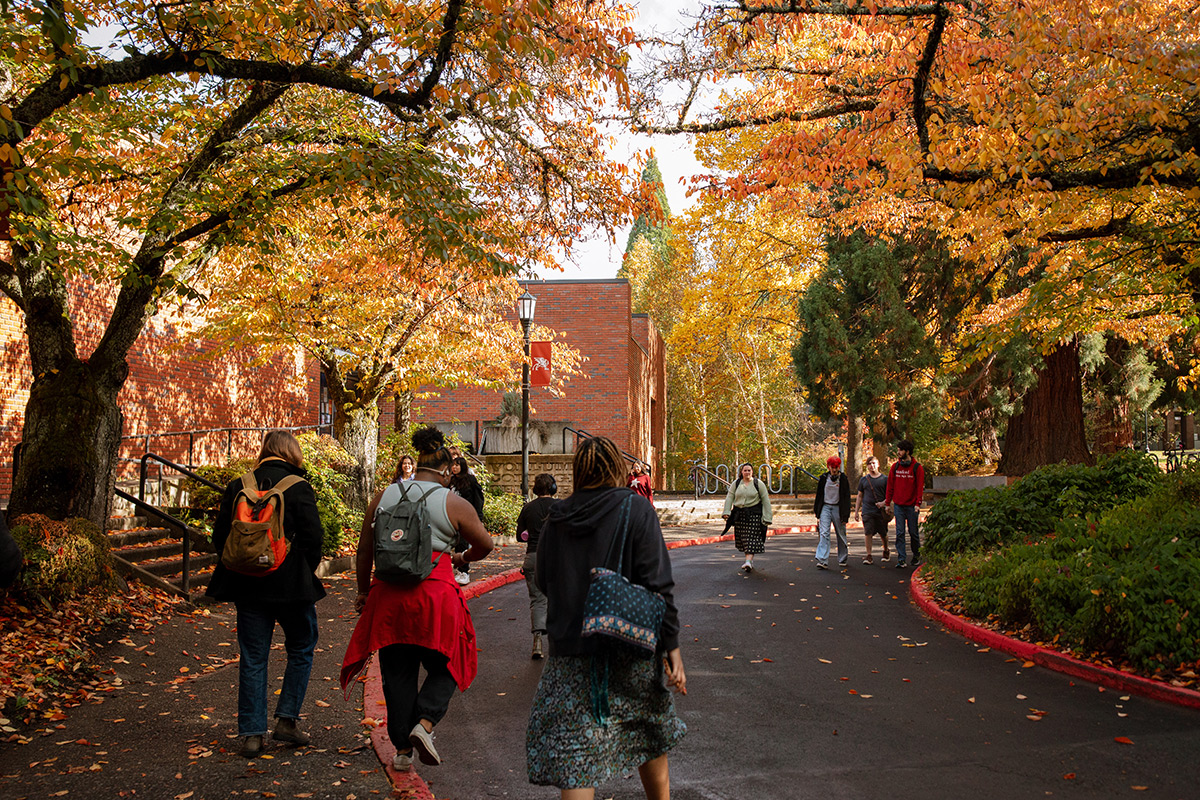 Reed students passing through Eliot Circle on a sunny autumn afternoon.