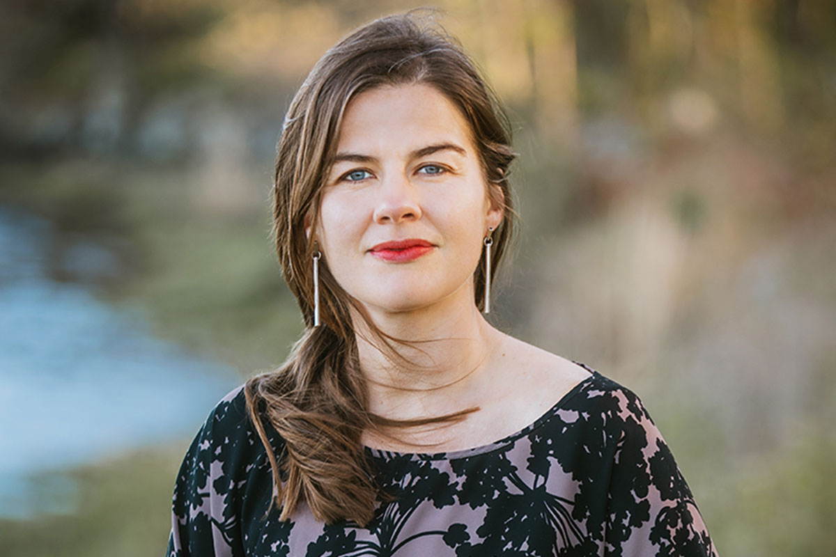 A woman, Elizabeth Rush, poses in a headshot.