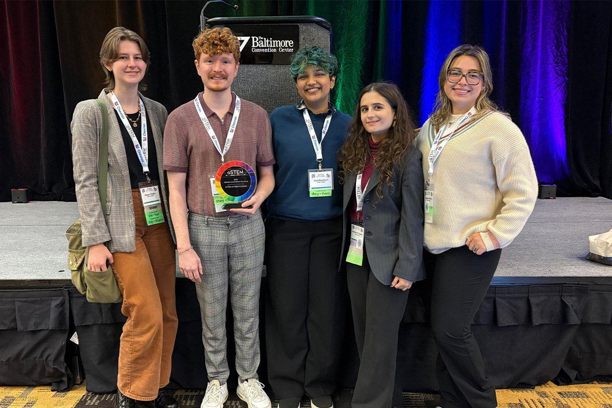 Students pose with an award for "Rookie Chapter of the Year" at the 2025 oSTEM conference. 