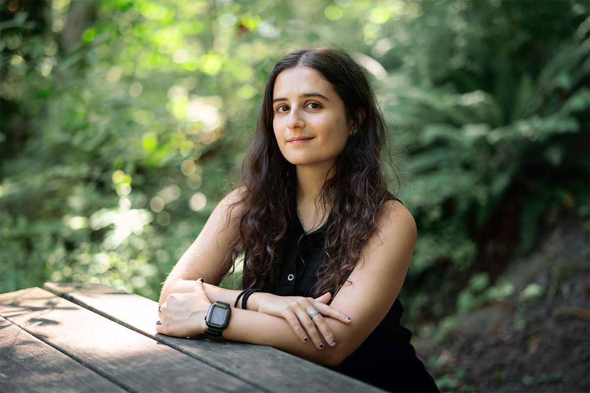 Miranda Kubek sits at a picnic table in the Reed canyon.