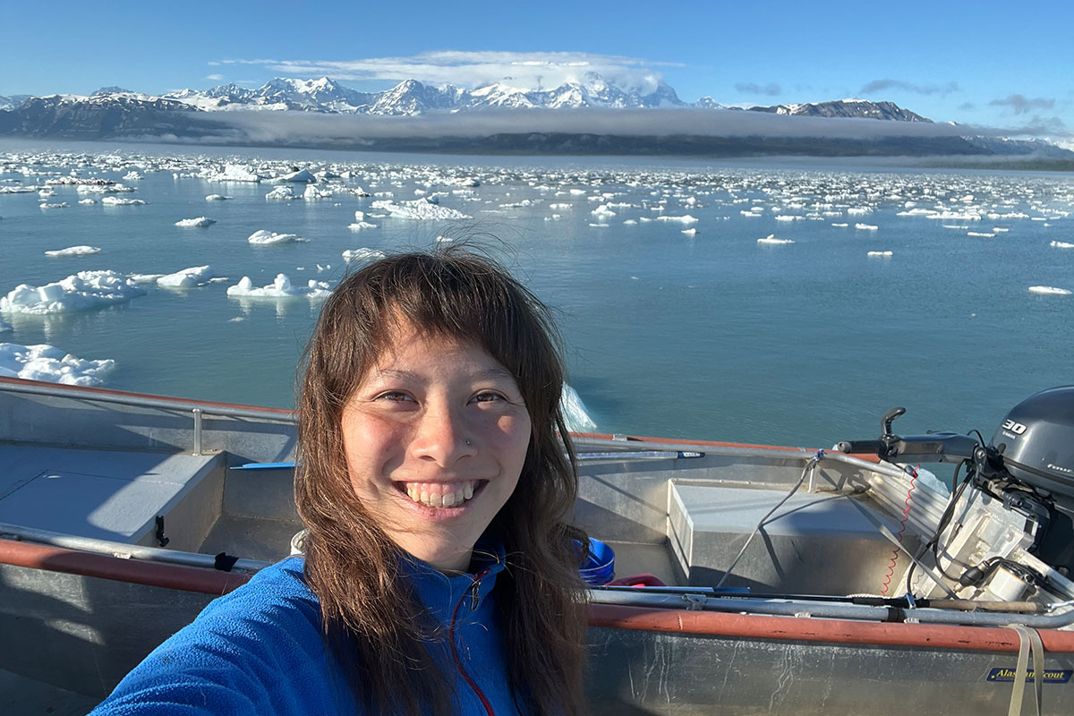 A selfie of Panya Cao ’28 on a boat with the icy bay behind her. 