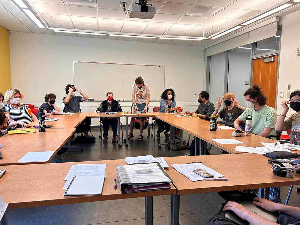 Theatre students at Reed sit around a table in class