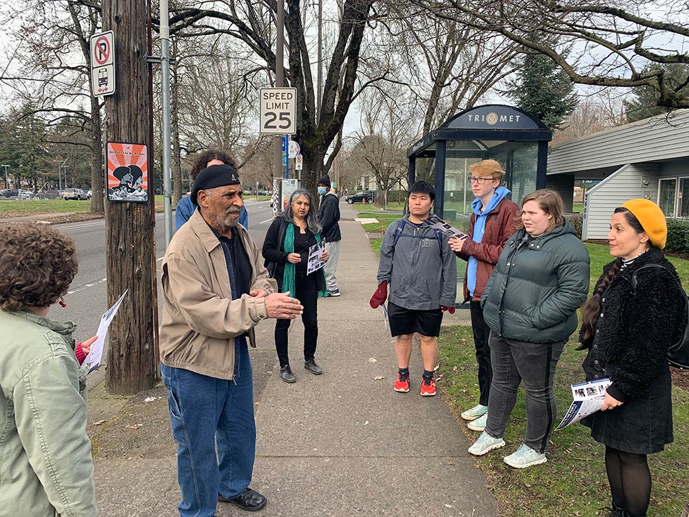 A photo of Mr Kent Ford on a walking tour of the Albina neighborhood with Reed students