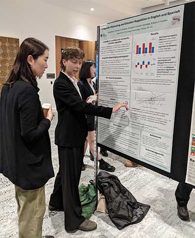 Lena Kassin presenting a poster at CogSci 2023