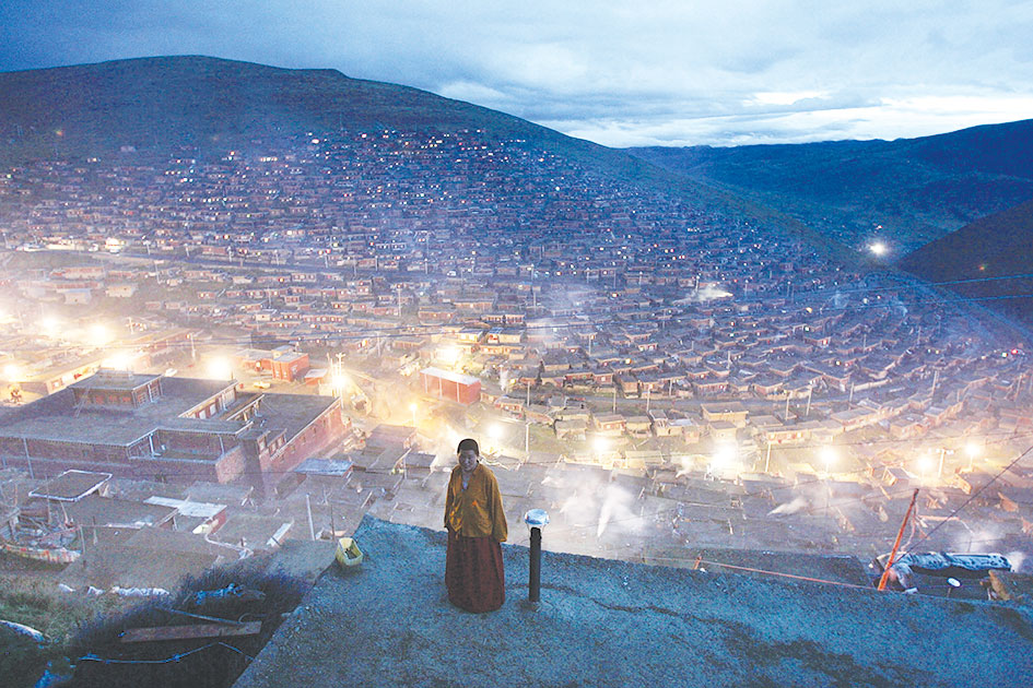 A Tibetan Buddhist nun looks out over Ganzizhou, in southwestern China&amp;#8217;s Sichuan province, 2006. Tension between ethnic Tibetans and the Chinese government has risen in recent months.&amp;#160;
