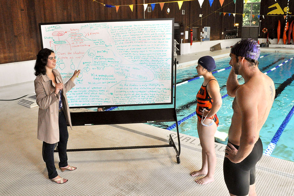 (Meta)physical education: lifeguard Eliya Cohen &amp;#8217;15 (left) talks philosophy with Reed swimmers.