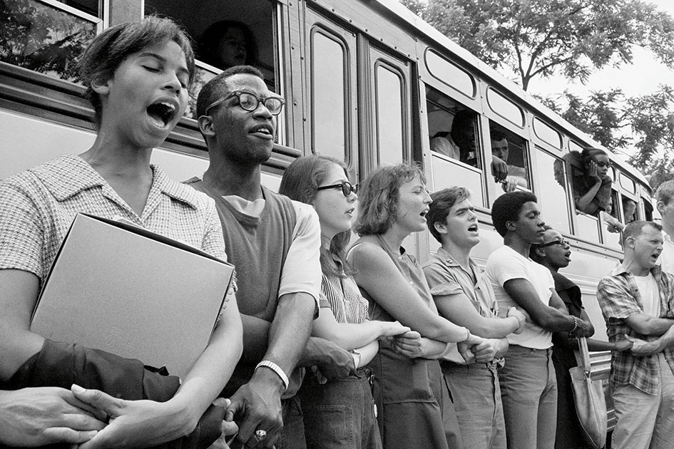 Student civil rights activists singing as they prepare to leave Ohio to register black voters in Mississippi. The 1964 voter registration campaign was known as Freedom Summer.