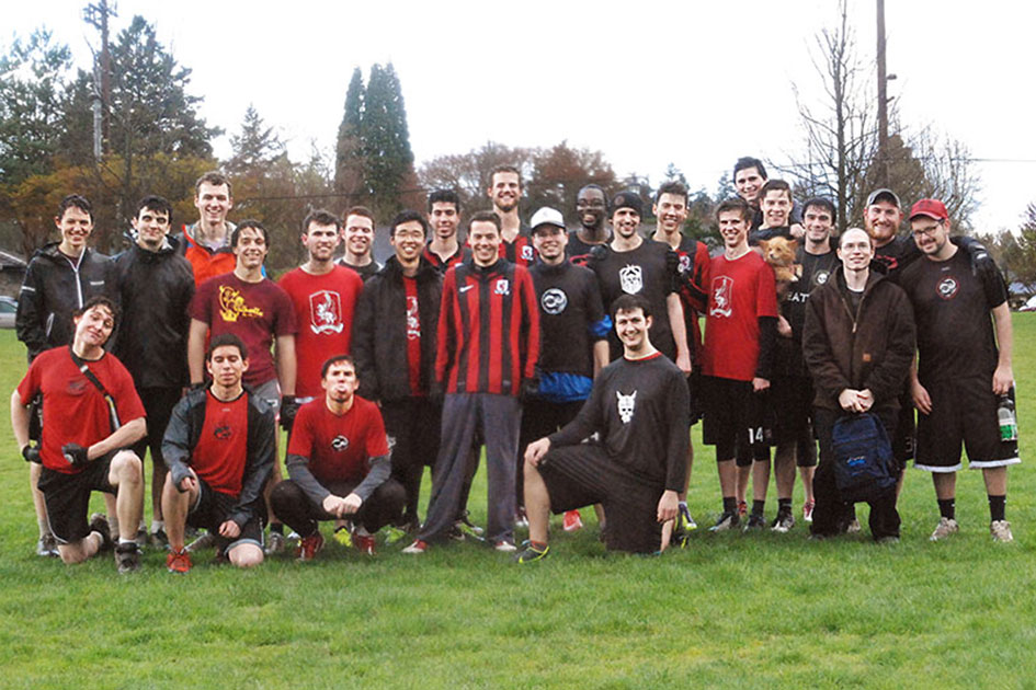 FEEL THE LOVE. Alumni and student Ultimate Frisbee players grinning after epic scrimmage.