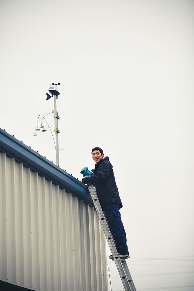 Alan Tuan on a ladder