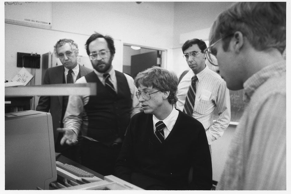 Bill Gates and Richard Crandall at the computer on the occasion of Gates receiving the Vollum Award, August of 1984. Also pictured: Robert Reynolds, Scott Gillespie '84