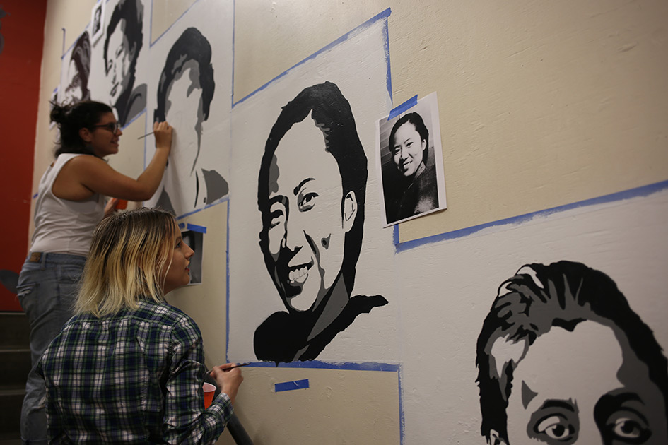 Aja Procita &amp;#8217;18 (left) and Ira Globus-Harris &amp;#8217;18 (right) paint the faces of important female physicists.