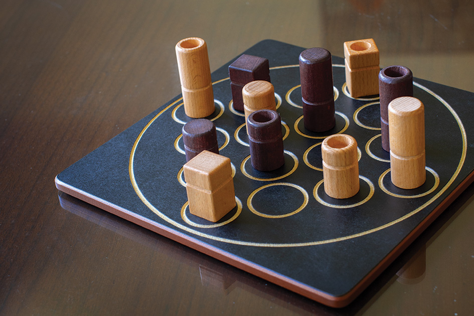 The game of Quarto was invented by Swiss mathematician Blaise M&amp;#252;ller. Players take turns choosing a game piece which the&amp;#160;other&amp;#160;player must place on the board. The winner is the player who first completes a line of four pieces that share a quality such as roundness, hollowness, and so on.