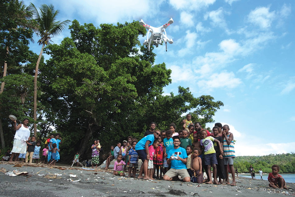 UNICEF&amp;#8217;s Joseph Hing and Rebecca Olul demonstrate a drone to children in the remote village of Epi in Vanuatu, a nation spread out across 83 volcanic islands.
