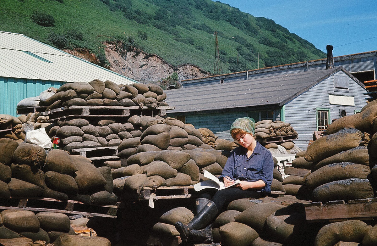 Mossy in 1962 taking a break from canning king crab in Kodiak, Alaska