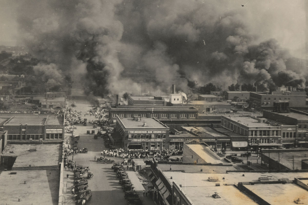 Photo montage of crowds of people watching the fires burning in the Greenwood community of Tulsa, Oklahoma on June 1, 1921.