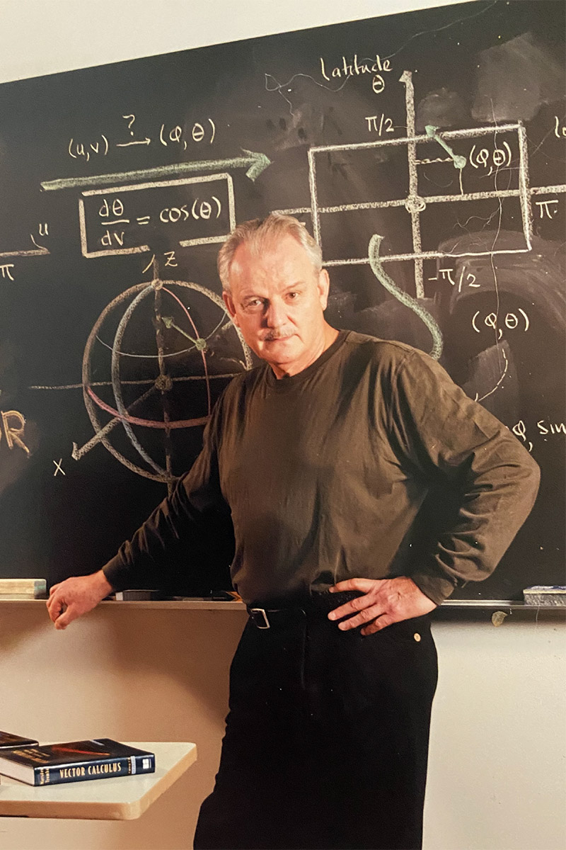 Photo of Prof. Wieting standing in front of a chalkboard