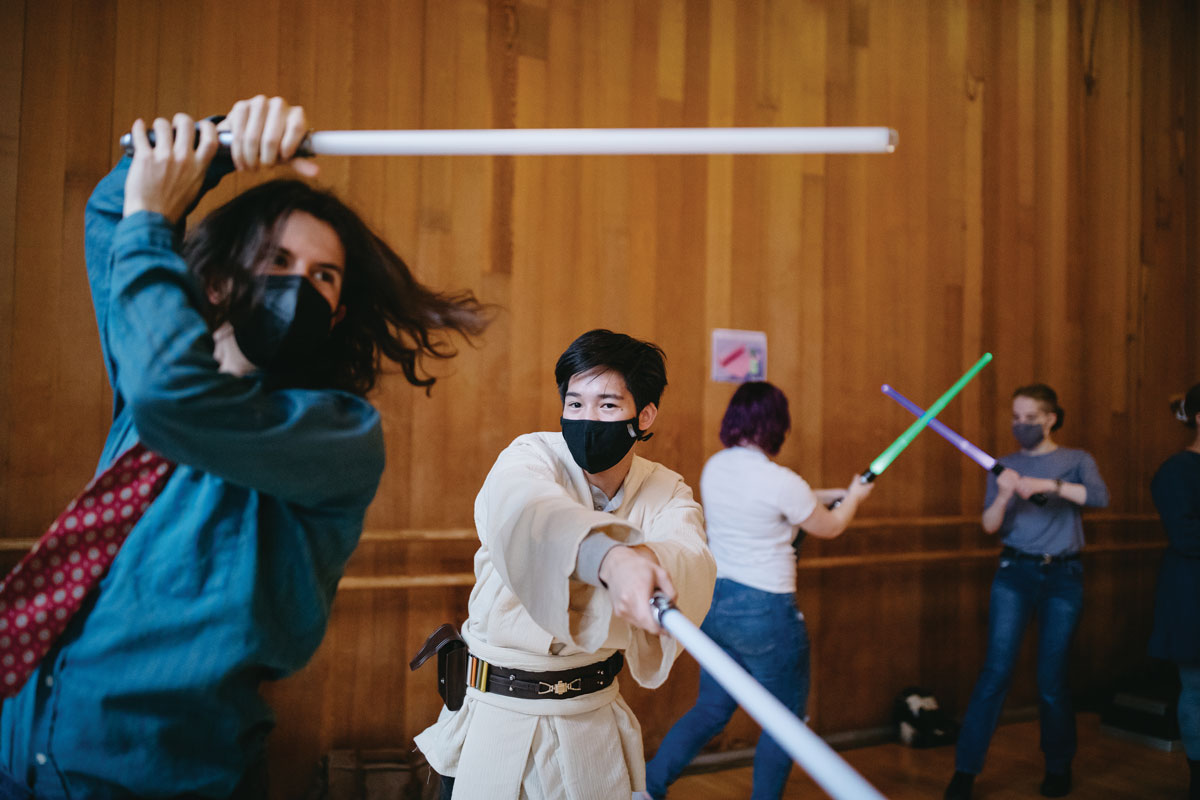 SWORD PLAY:&amp;#160;Partners spar during the Reed Lightsaber Academy, held during Paideia.