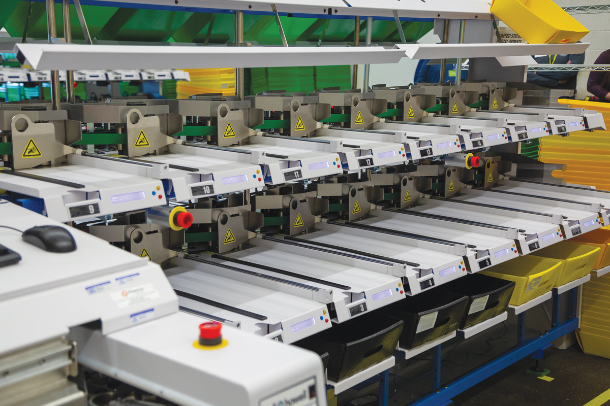 Multnomah County's ballot sorting equipment. Prof. Gronke researches voting practices, including early voting and vote-by-mail systems.