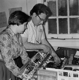 Beth Berry Barber ’63 and Paul Hoyer ’64 install new control console in KRRC