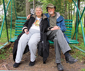 Brad and Rozelle perched on swing near the Tolstoy Estate