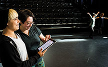 Prof. Hannah Kosstrin uses KineScribe to go over dance moves with Jackie Davis ’14.