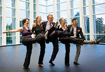 Prof. Hannah Kosstrin, Prof. Carla Mann ’81,  former prez Colin Diver, Joan Diver, and Prof. Minh Tran do the can-can in the Steiner Dance Studio.