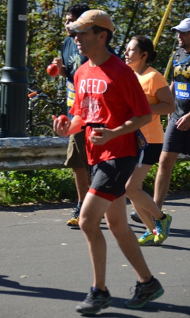 CUS director Tony Palomino juggles at Portland Marathon