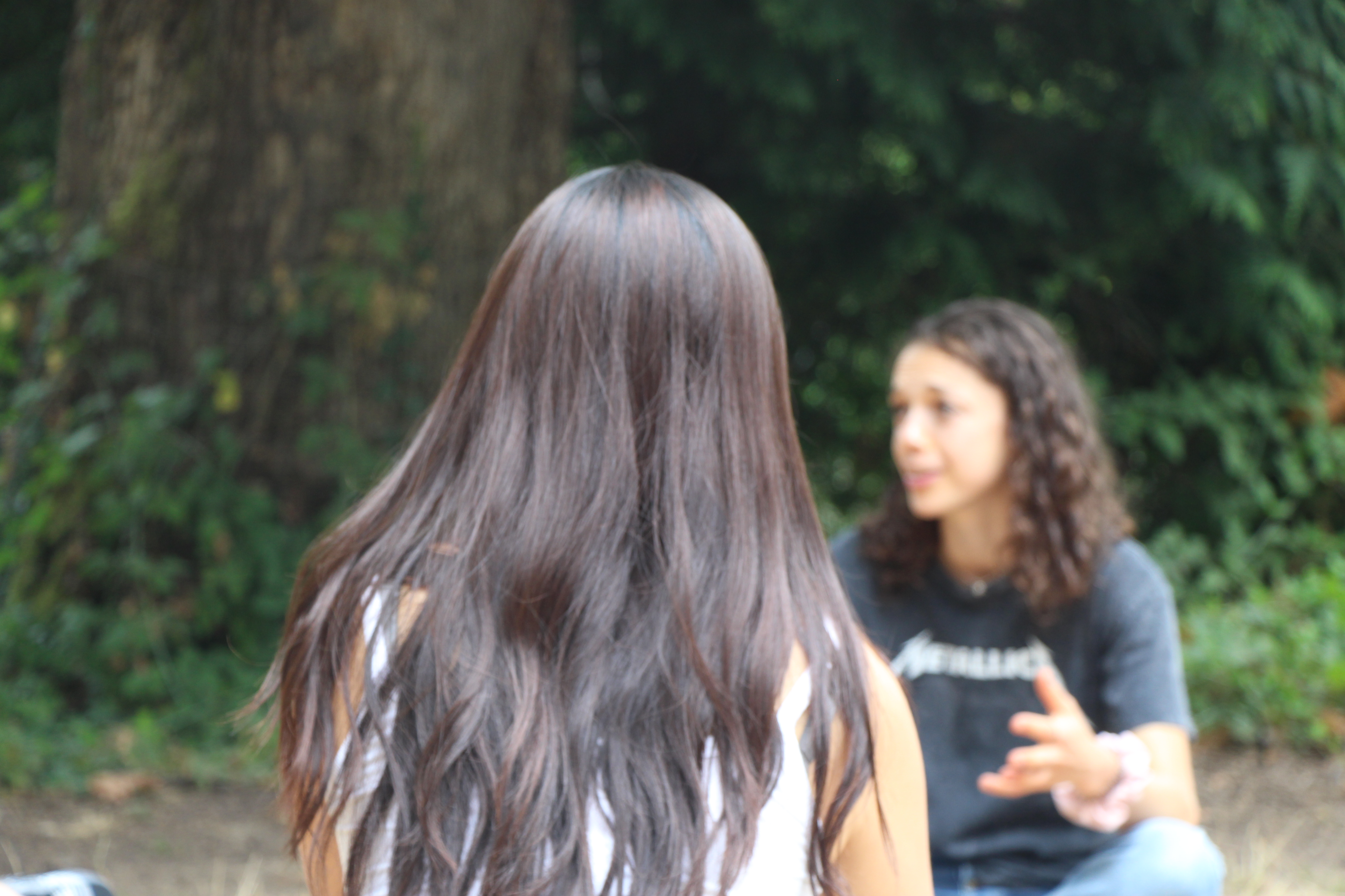 Two Reed students having a discussion outside
