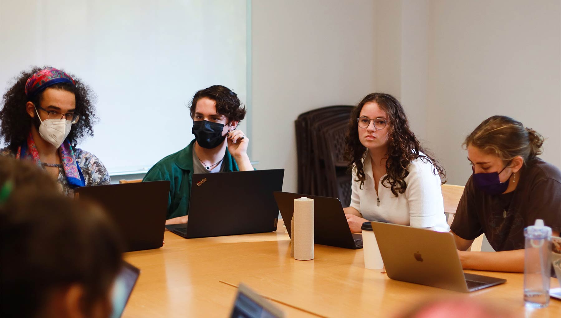 Fours students listening intently during a Spanish class.